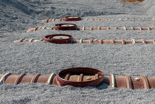 Fototapeta Gasoline Storage Tanks Partially Installed At New Gas Station