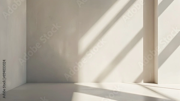 Fototapeta A room with a white wall and a window. The sunlight is shining on the wall, creating a bright and open feeling