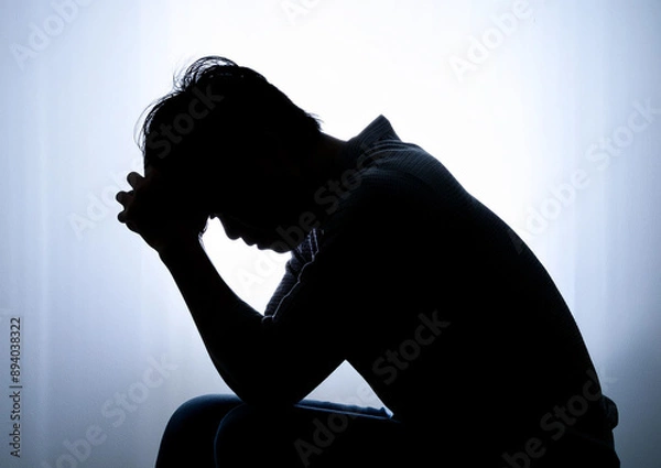 Obraz 頭を抱えて落ち込む女性シルエット