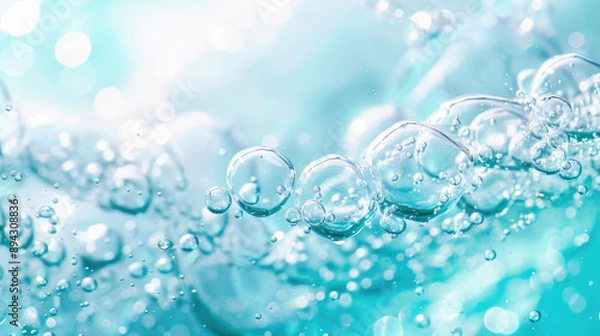 Fototapeta Oxygen bubbles in clear blue water, close-up. Mineral water. Water enriched with oxygen.