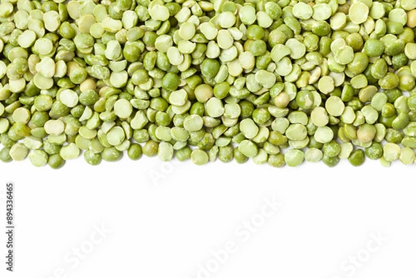 Fototapeta Uncooked, green peas border on white background. Copy space for text. Top view