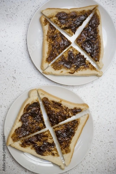 Fototapeta Slices of Vegemite & bread (quartered, yeast extract spread, Australia)