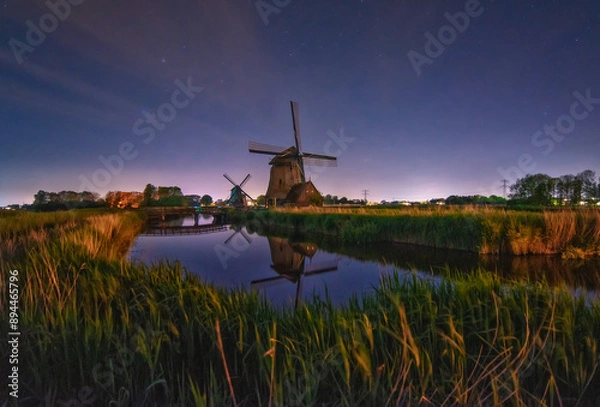 Fototapeta reflection of windmill in dutch countryside