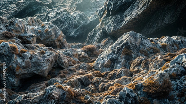 Fototapeta The sun shines through the rocks, creating a warm glow