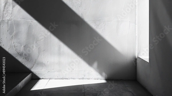 Obraz 光と影が白い壁に幾何学的な形を作り出している、モノクロ写真アート風背景グラフィック