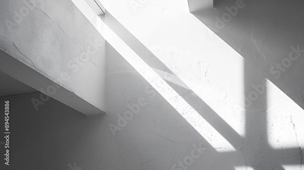 Obraz 光と影が白い壁に幾何学的な形を作り出している、モノクロ写真アート風背景グラフィック
