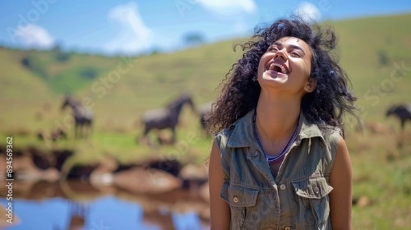 Fototapeta Smiling woman enjoying a wildlife safari, with animals and a scenic landscape in the background