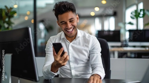 Fototapeta Businessman using smartphone in modern office, smiling