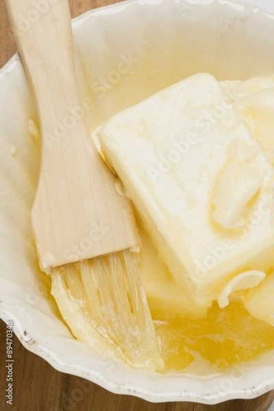 Fototapeta Melting butter with pastry brush in dish (close-up)
