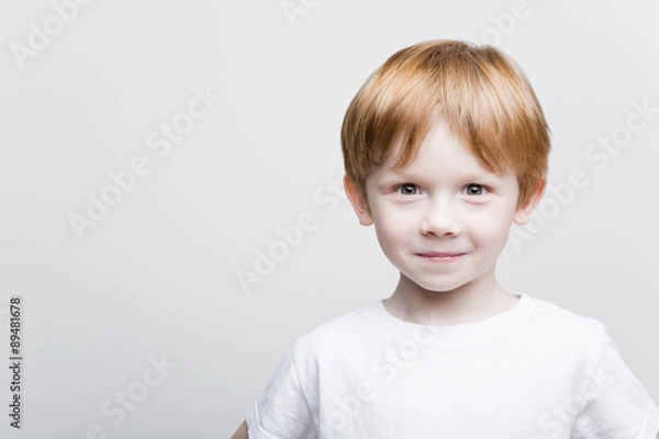 Obraz The red-haired kid slyly looks