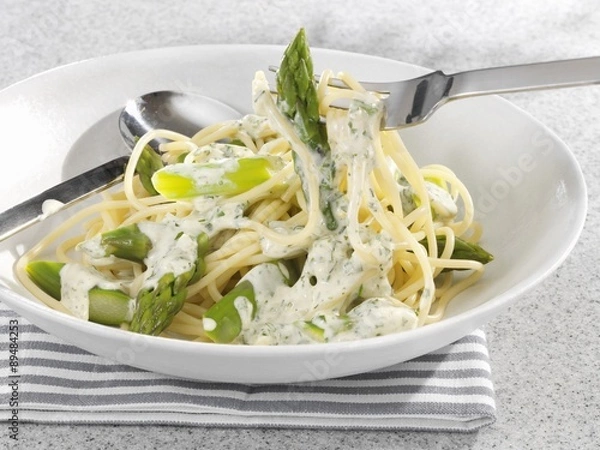Fototapeta Spaghetti with green asparagus and cream sauce