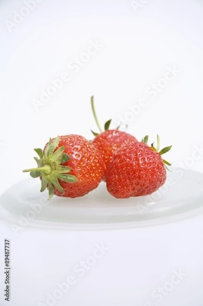 Fototapeta Three strawberries