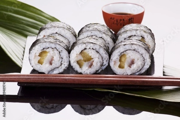 Fototapeta Maki sushi with herring and gherkins