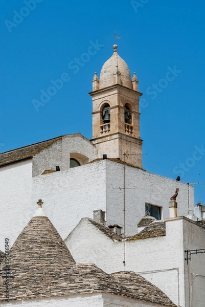 Obraz Trulli of Alberobello with Chiesetta Rettoria SS. Sacramento and S.Lucia,  a UNESCO heritage site.