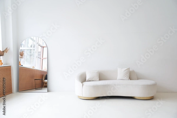 Fototapeta Modern interior in the style of white minimalism. Modern interior design for posters in the living room with a white sofa and with space for copying. High quality photo