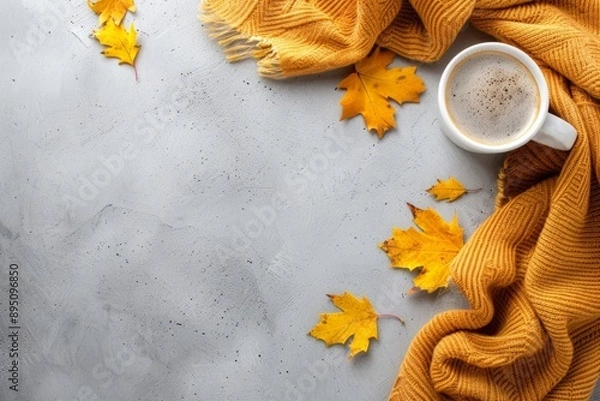 Obraz Cozy Autumn Concept with Warm Sweater, Coffee Cup, and Maple Leaves on Gray Background