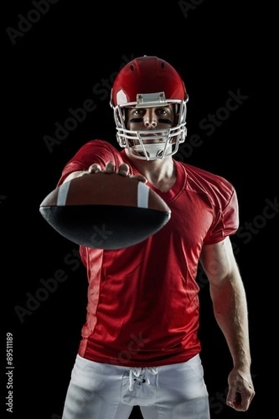 Obraz American football player showing ball