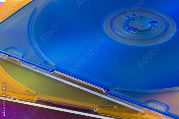 Fototapeta three CD or DVD optical disks in colorful jewel cases