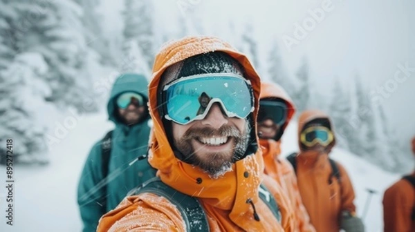 Fototapeta A group of friends on a hiking adventure in snowy mountains, dressed in colorful gear, displaying camaraderie and the beauty of a challenging yet rewarding winter trek.