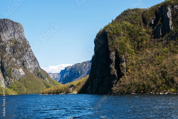 Fototapeta Departing from Western Brook Gorge, one last glance is cast over the precipitous rock cliffs, with Pissing Mare Falls lingering distantly in the backdrop.
