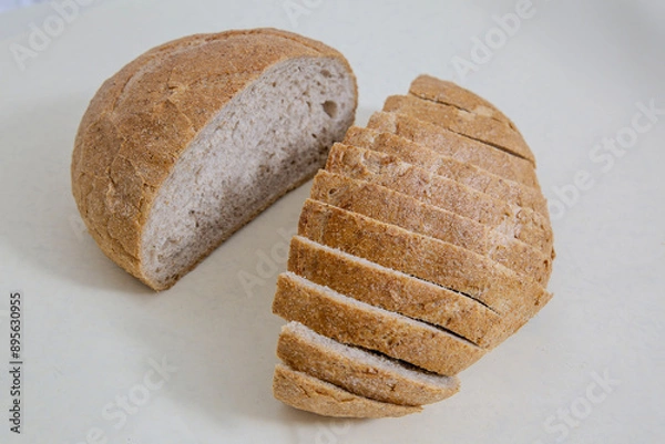 Fototapeta Slice of Sourdough Bread isolated on white background. Piece of yeast rye or wheat artisan bread, design element.