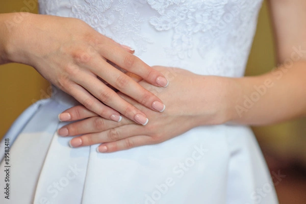 Fototapeta hands of a bride with a wedding manicure