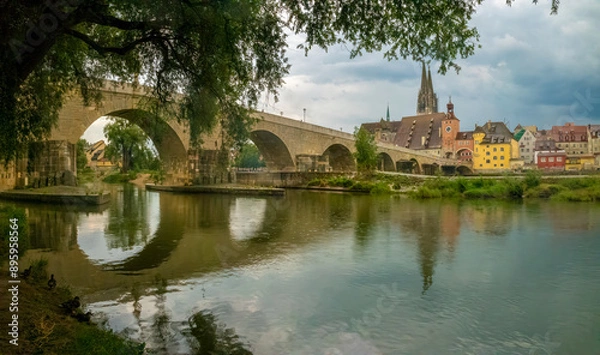 Fototapeta Idyllic riverside scenes of the medieval old town of Regensburg at confluence of the Danube, Naab and Regen rivers, Upper Palatinate, Bavaria, Germany