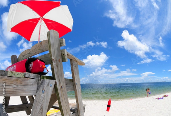 Obraz Lifeguard stand and umbrella at beach