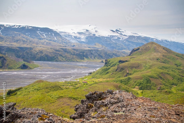 Fototapeta Rivers meandering through the Thorsmork valley in South Iceland during Summer amidst panoramic backdrop of mountains and glaciers