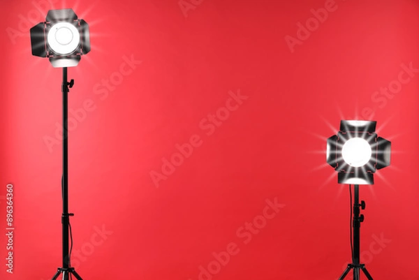 Fototapeta Red photo background and professional lighting equipment in studio