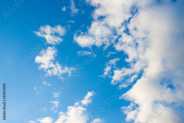Fototapeta blue sky background with tiny clouds