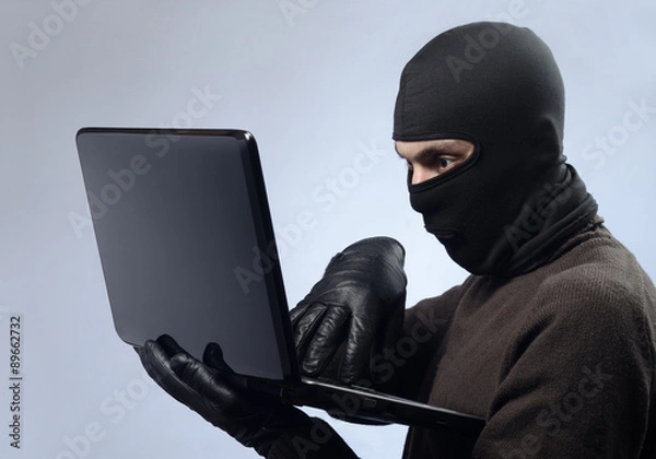 Fototapeta stealing data from a laptop