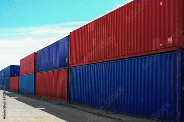 Obraz Cargo containers against blue sky 