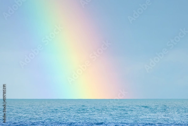 Fototapeta The end of the rainbow out to sea,  no people, space for text, sunny bright clear day, UK England