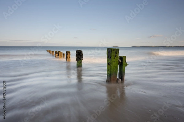 Obraz Youghal Strand Groynes on a warm summer evening 2