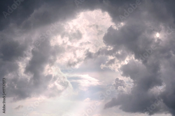 Fototapeta Sunlight Breaking Between Cumulonimbus Clouds