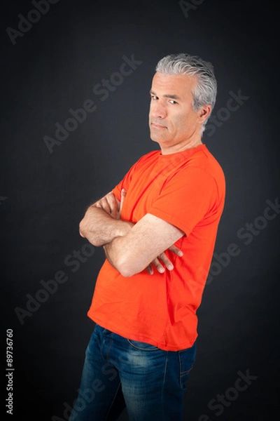 Fototapeta Handsome man doing different expressions in different sets of clothes: arms crossed