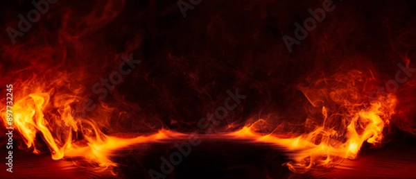 Fototapeta Dramatic fire and smoke effect glowing red and yellow colors exploding outwards with center space. Vivid and hot hell abstract or blazing fire background or wallpaper