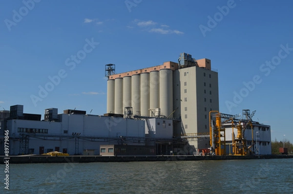 Fototapeta view on industrial sites next to canal