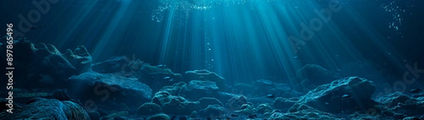 Fototapeta Dark blue ocean floor with rocks, underwater background scene with sunlight filtering through the water, sea life in shades of blue