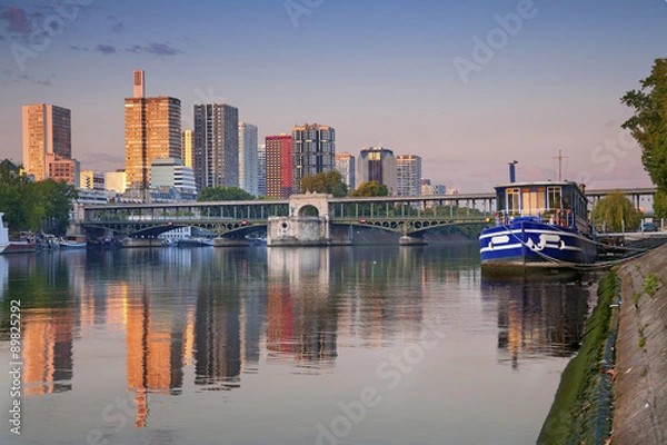 Fototapeta Paris. Image of modern architecture in Paris with the Pont de Bir- Hakeim and Seine river.