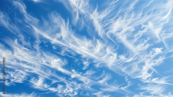 Fototapeta Wispy clouds creating patterns in a clear sky, intricate and delicate, cloud patterns