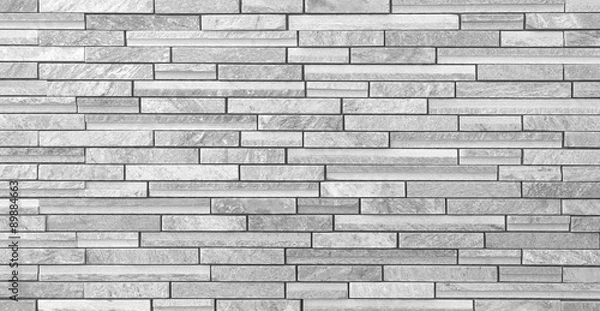 Fototapeta Texture and seamless background of white granite stone block wall..