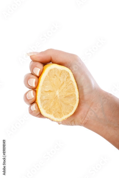 Obraz Young woman squeezing lemon
