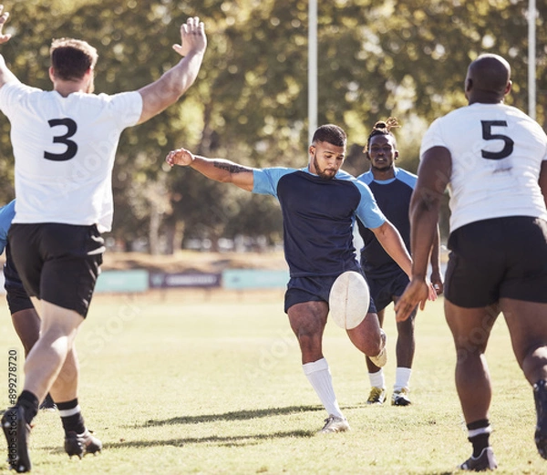 Obraz Sports, drop goal and rugby team on field for training, match or skill development for try. Fitness, defense and player kick ball for scoring penalty at practice, game or tournament with opponent.