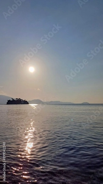 Obraz Sunrise on the island Zakynthos in Greece. On the left Cameo island.