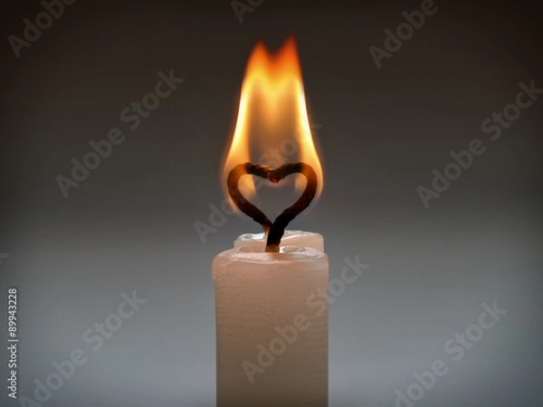 Fototapeta Two candles with heart-shaped flame