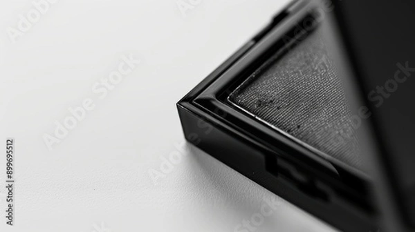Fototapeta Sleek and professional black eyeshadow palette on a white background, highlighting its elegant design
