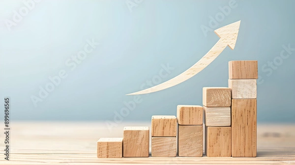 Obraz growth and progress through ascending wooden blocks and a curved arrow pointing upward