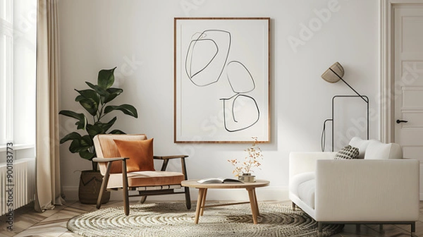 Fototapeta Picture frame with line art by a reading coffee table in a living room